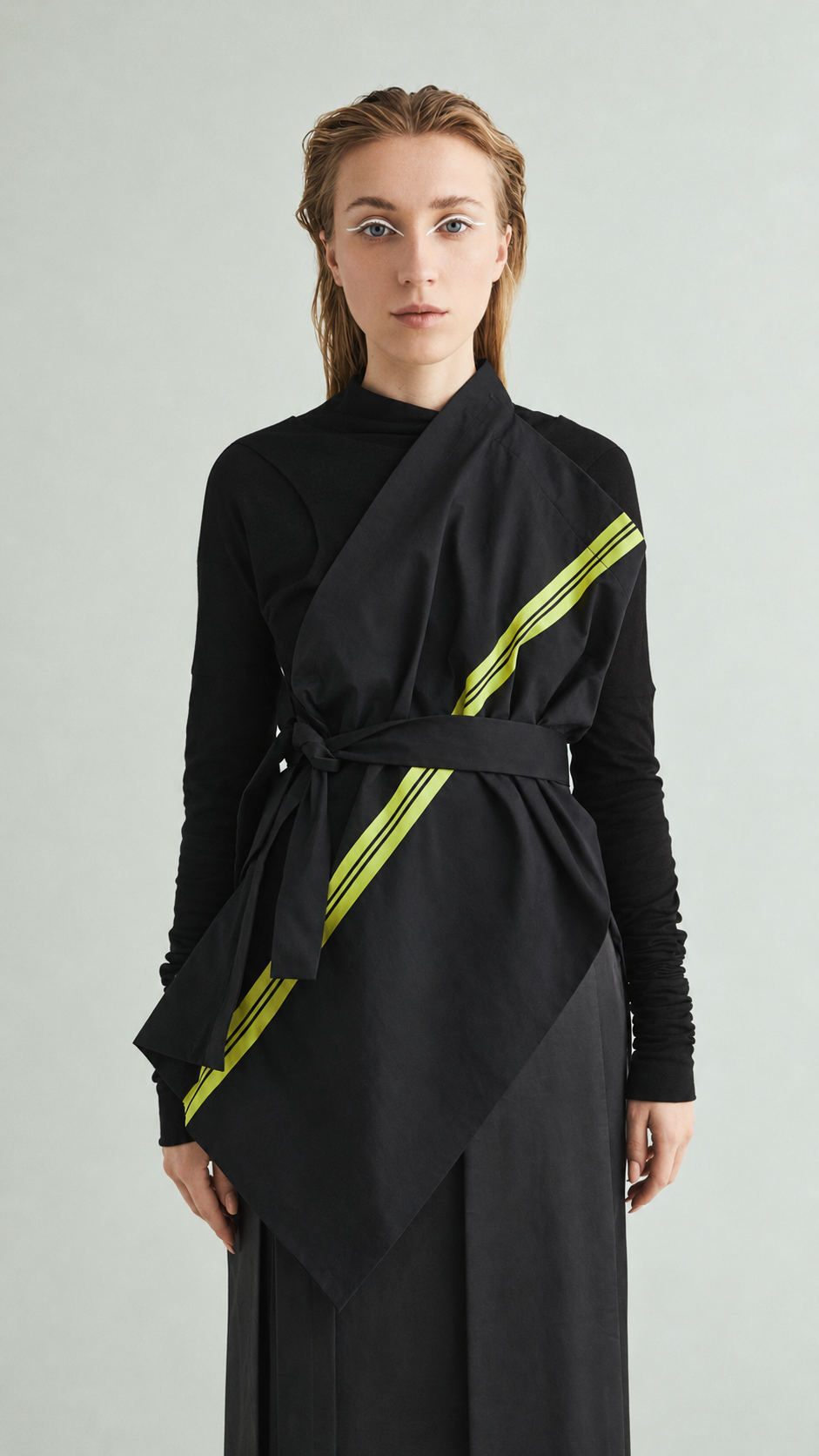 LIME VEST /06 worn asymmetrically with diagonal lime detail; retouched product photograph.