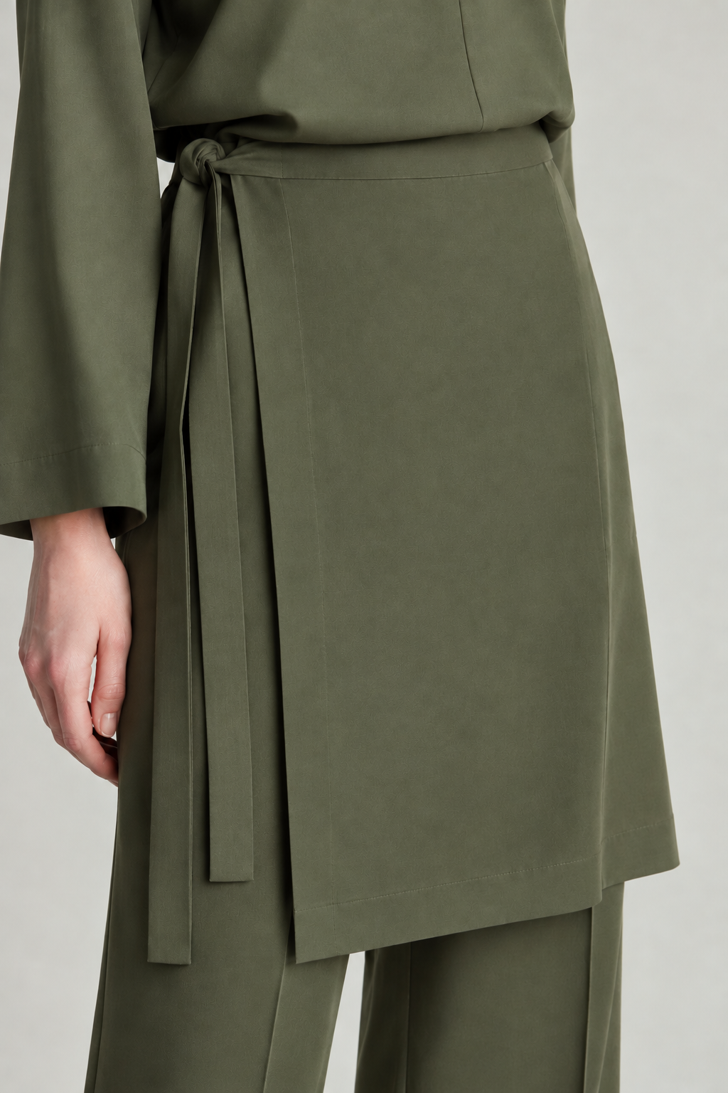 Close-up olive Tencel wrap overskirt over Straight Pants Motion