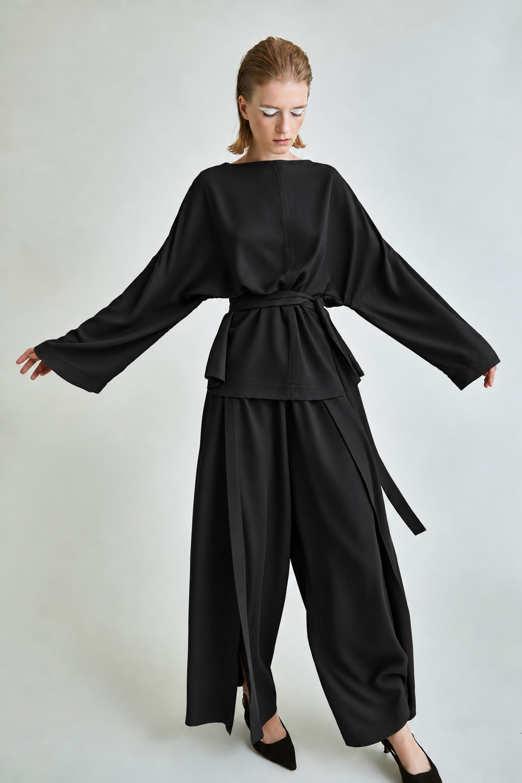 Black Tencel MOTION trousers styled with the long sleeve top